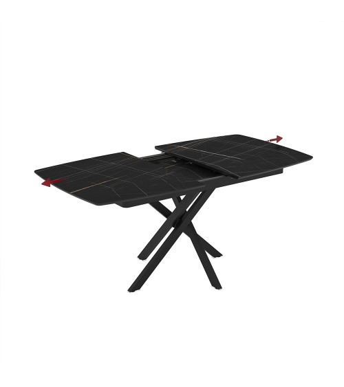 Tavolo allungabile Filis con piano effetto marmo nero con dettagli oro matt e gambe in metallo nero